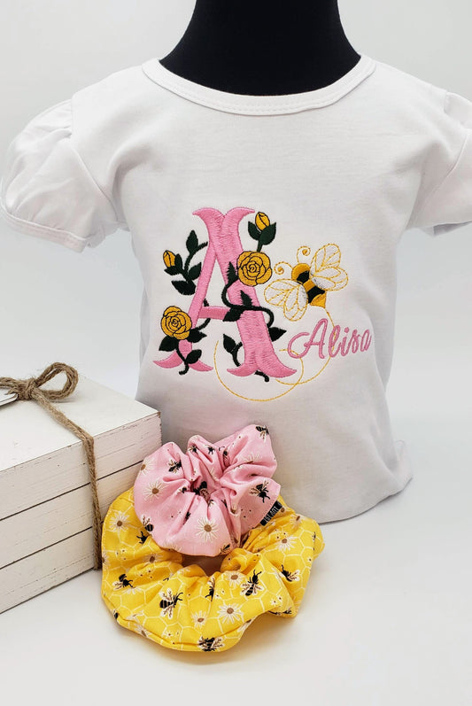 Monogram Bee shirt with name in cursive.