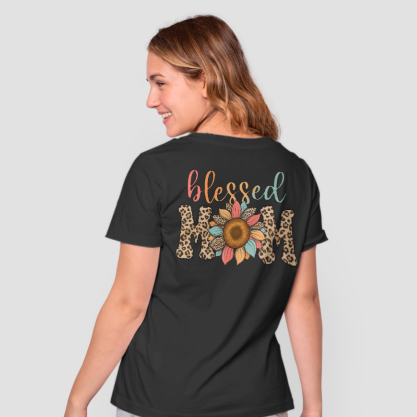 Blessed mom shirt has the word Blessed in a Ombre of red orange to green. Mom is in a leopard design with a multi color sunflower cursive